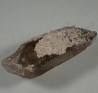 Tabular bertrandite crystals om quartz