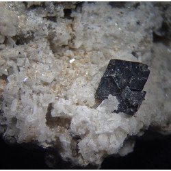 Frosty appearance of quartz-coated bertrandite