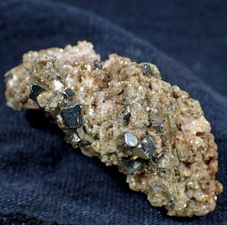 Muscovite, pyrite, bertrandite