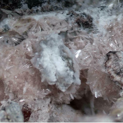 Close-up of pale pink, acicular zorite