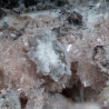 Close-up of pale pink, acicular zorite