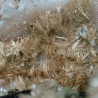 Pale brown acicular raite